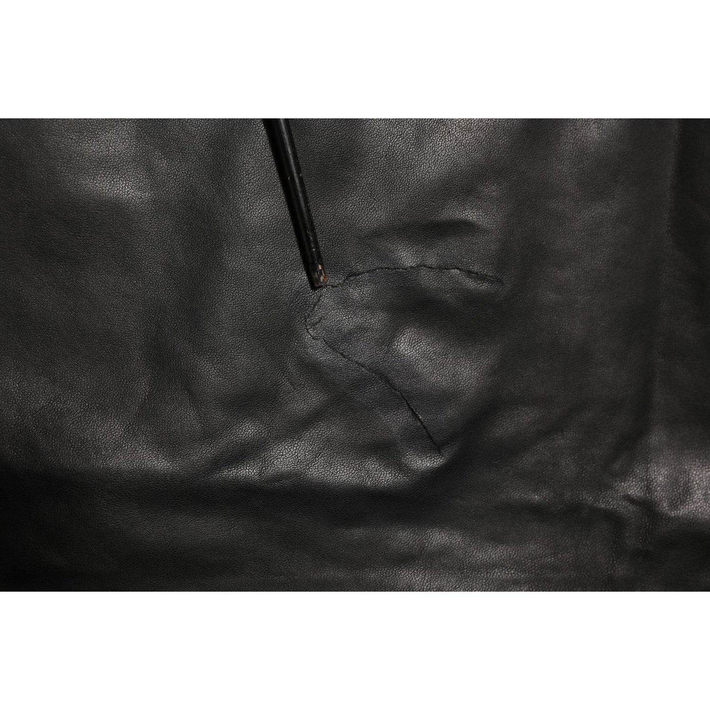 Close-up of Dolce & Gabbana Black Lamb Leather Trousers Men Pants showcasing luxurious material and craftsmanship detail.