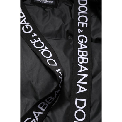 Close-up of Dolce & Gabbana Black Logo Full Zip Hooded Quilted Jacket showing logo details on black nylon material.