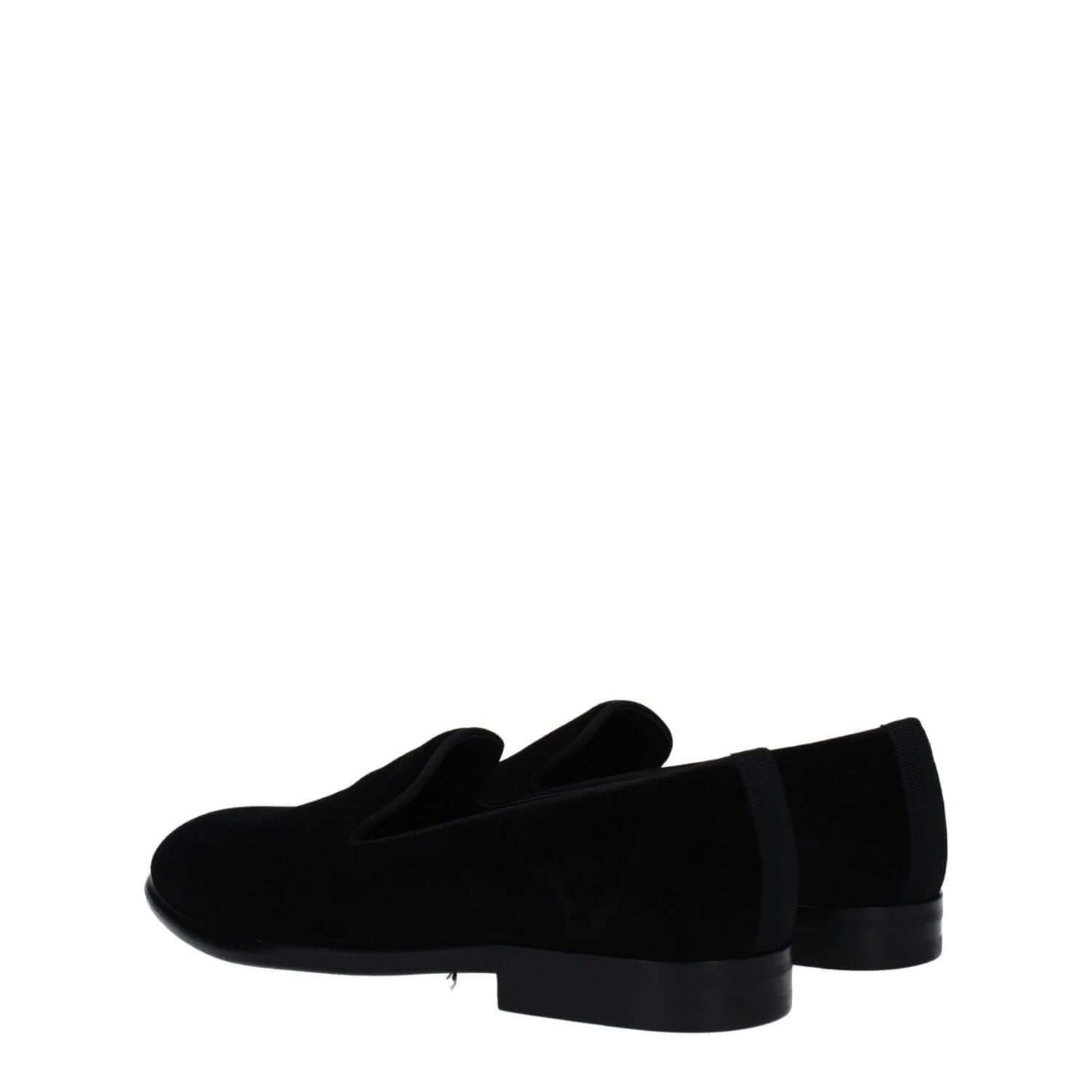 Dolce & Gabbana Black Velvet Slip-On Loafers with leather soles and round toe, stylish design in a low flat heel silhouette.