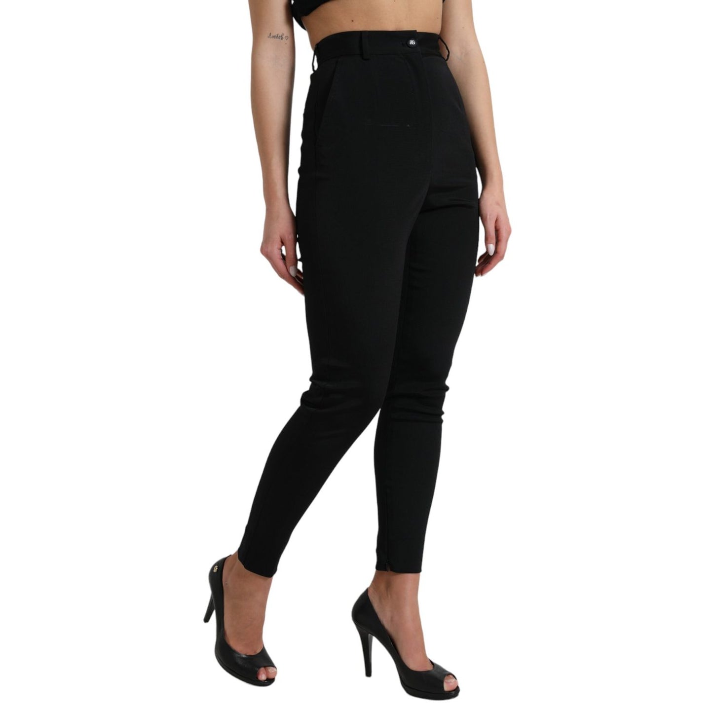 Woman wearing Dolce & Gabbana Black Wool Stretch High Waist Skinny Pants with heels, showcasing the sleek fit and design.