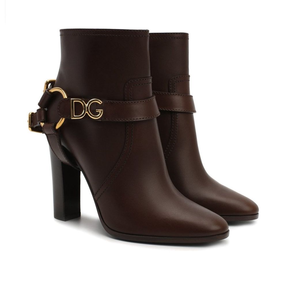 Dolce & Gabbana Brown Leather Ankle Boots with gold detail, zip fastening, detachable name tag, and 11 cm heel, made in Italy.