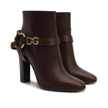 Dolce & Gabbana Brown Leather Ankle Boots with gold detail, zip fastening, detachable name tag, and 11 cm heel, made in Italy.