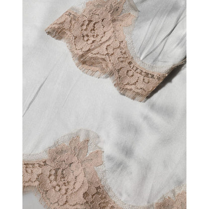 Close-up of Dolce & Gabbana Gray Silk Satin Floral Lace Long Sleeve Top showcasing delicate floral lace detailing.