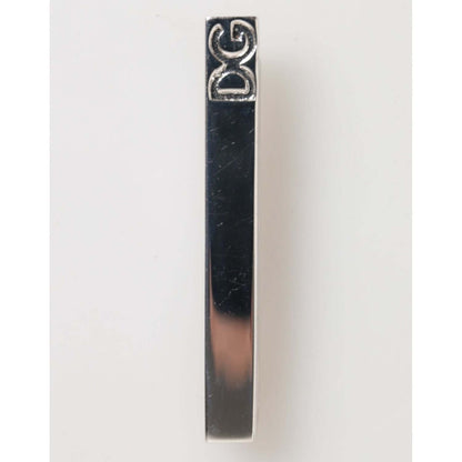 Dolce & Gabbana Silver Tone Brass Logo Branded Men Accessory Tie Clip Bar featuring engraved logo on a polished surface.