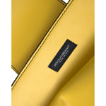 Interior view of Dolce & Gabbana Yellow Smooth Leather DG Logo Clutch Crossbody Case Bag with brand label visible.