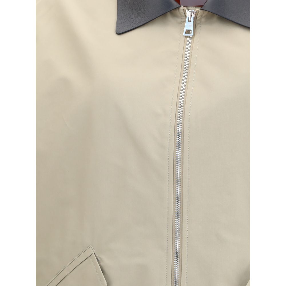 Close-up of Givenchy Beige Cotton Jackets And Coat with zipper and leather collar detail.