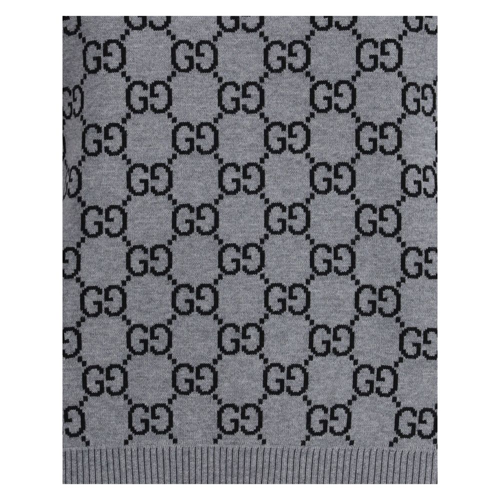 Gucci Gray Wool Sweatshirt featuring GG Supreme pattern and ribbed hem, showcasing retro-inspired design for stylish versatility.