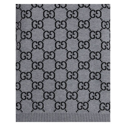 Gucci Gray Wool Sweatshirt featuring GG Supreme pattern and ribbed hem, showcasing retro-inspired design for stylish versatility.