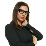 Woman wearing Marciano by Guess Brown Women Glasses Frame with a cat-eye full-rim design.