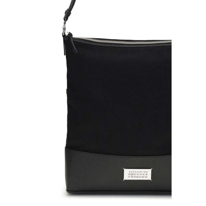 Margiela Black Cotton Shoulder Bag with iconic label and leather strap.