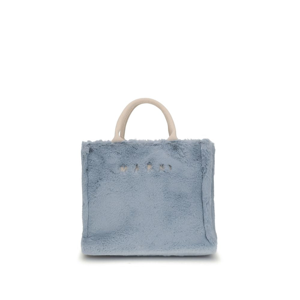 Marni Light Blue Polyester Handbag with fur lining and fabric handles, featuring a bold design and adjustable shoulder strap.