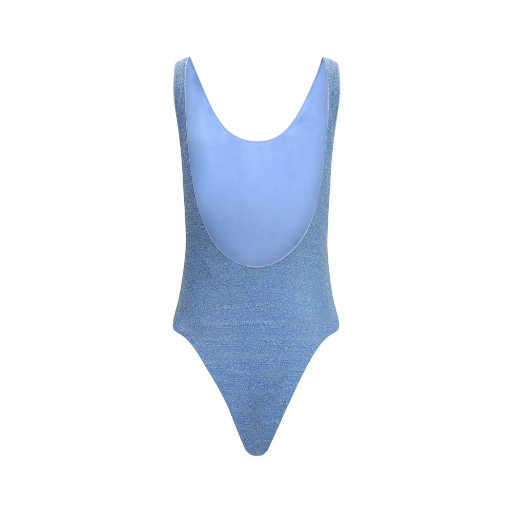 Back view of Oséree Lumière Sporty One Piece Swimsuit in blue lamé fabric with scooped back design.