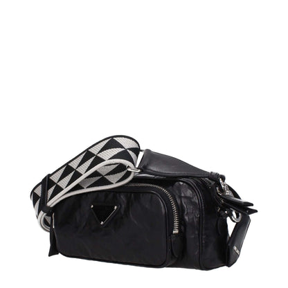 Prada Black Leather Crossbody Bag with adjustable strap, silver hardware, front logo, and zip closure. Perfect for stylish travel and daily use.