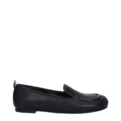 Premiata Black Leather Slip-On Loafers with round toe and low flat heel, featuring a back logo, shown from the side.