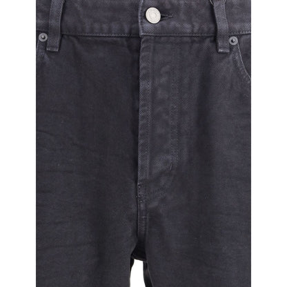 Close-up of Saint Laurent Black Cotton Straight-Leg Jeans with front zipper, button closure, and five-pocket design.