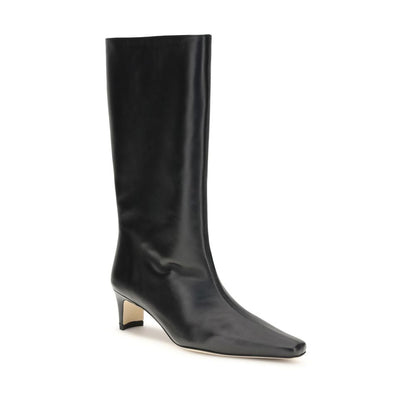 Staud Black Lamb Ovis Aries Aries Boots with smooth leather, sharp toe, and slim heel showcasing timeless elegance.