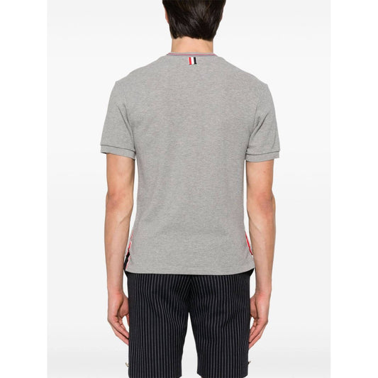 Back view of Thom Browne T-shirts and Polos Light Grey with signature stripe detailing and logo patch.