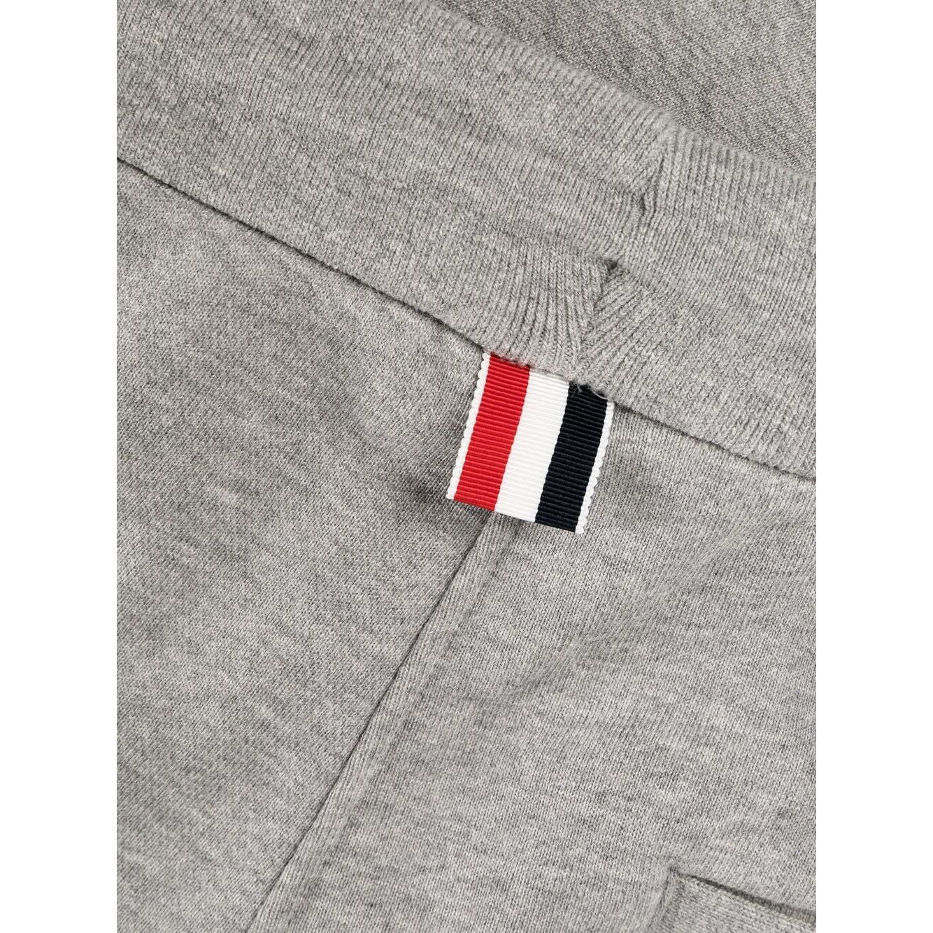 Close-up of Thom Browne Trousers Grey with signature 4-Bar grosgrain loop and drawstring waist detail.