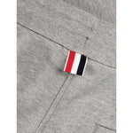 Close-up of Thom Browne Trousers Grey with signature 4-Bar grosgrain loop and drawstring waist detail.