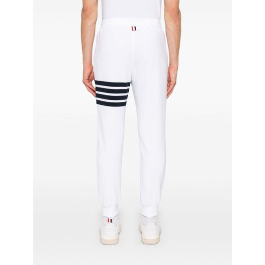 Thom Browne Trousers White with 4Bar design and elasticated waistband, back view showcasing logo patch and grosgrain tab.