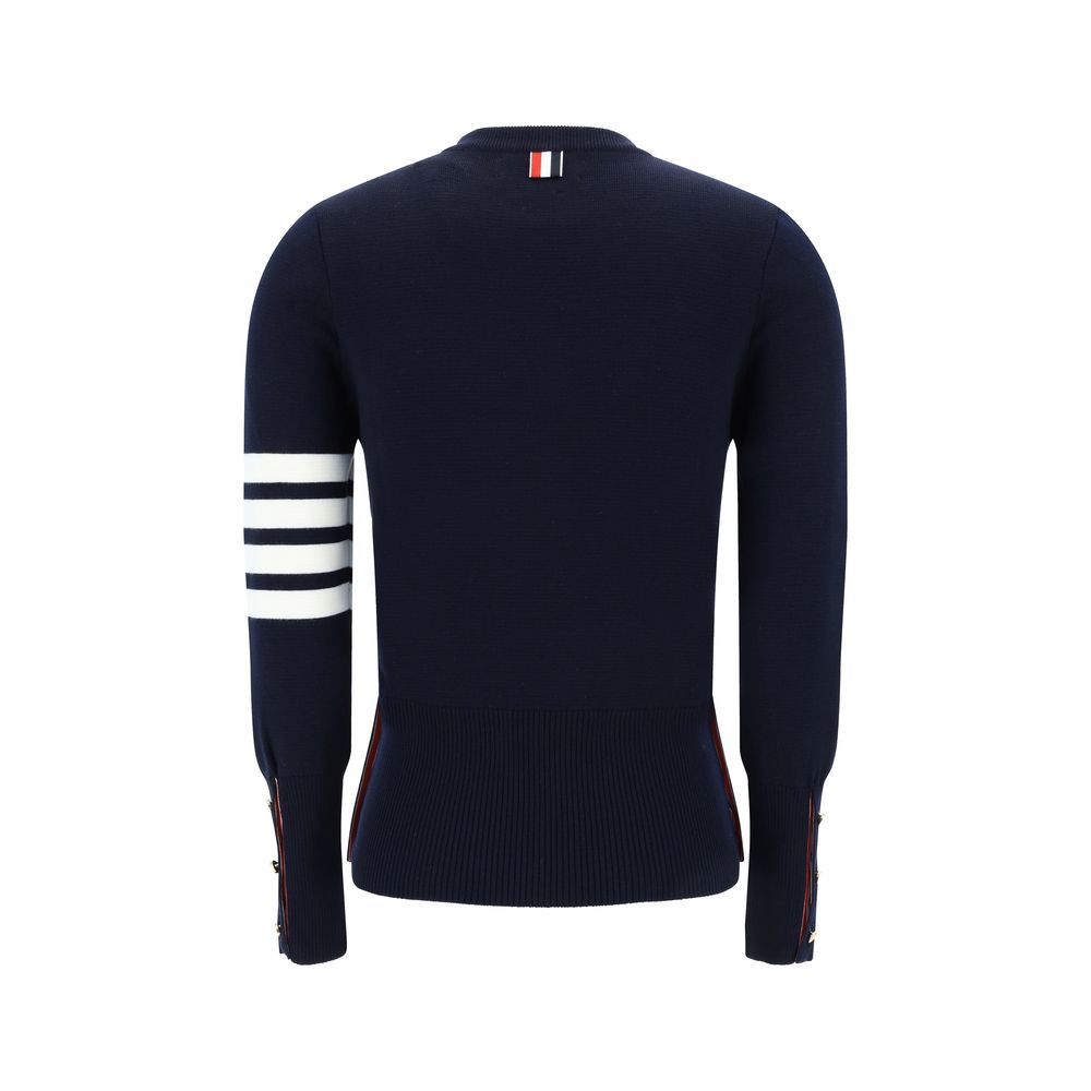 Back view of Thom Browne Virgin wool Sweater showcasing iconic horizontal bands and ribbed cuffs in navy blue.