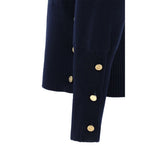 Detail of Thom Browne Virgin wool Sweater with ribbed cuff and gold buttons.