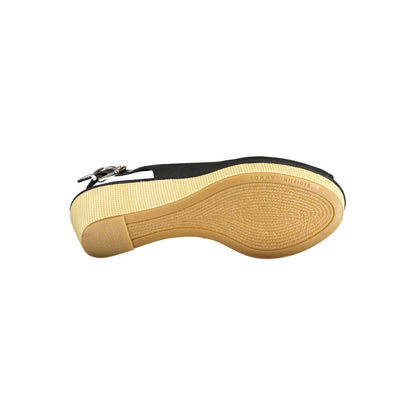 Sole view of Tommy Hilfiger Black Leather Women Sandal with iconic logo and sleek design.