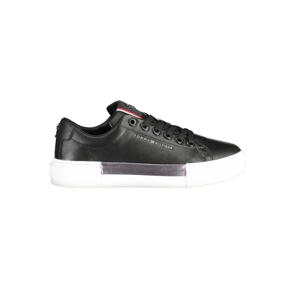Tommy Hilfiger Black Leather Women Sneaker with contrasting white sole and iconic logo for sporty chic style.