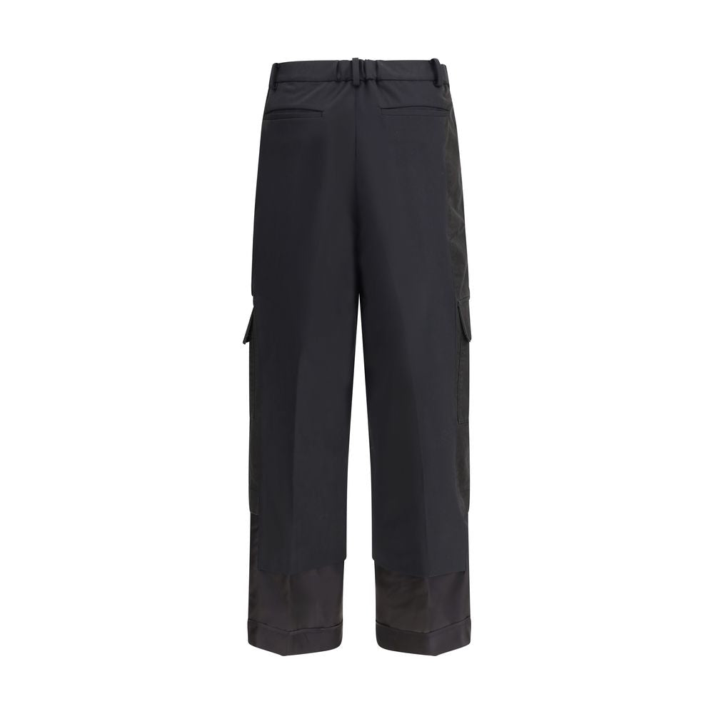 Undercover Black Polyester Cargo Pants with wide leg, side cargo pockets, hook-and-zip closure, and paneled design for AW25 Season.