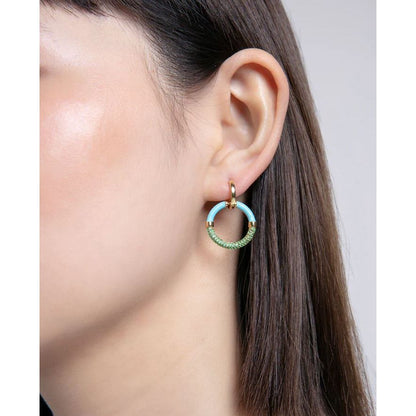 Close-up of a woman's ear wearing VICEROY JEWELS Mod. 13199E100-99 silver earrings with quartz analog detail.