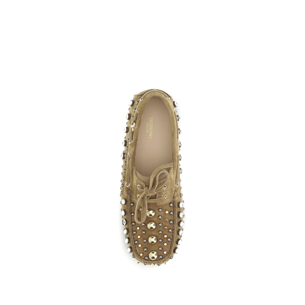 Valentino Garavani Beige Calf Leather Bos Taurus Slip-On Loafers with studs and rhinestones, top view.