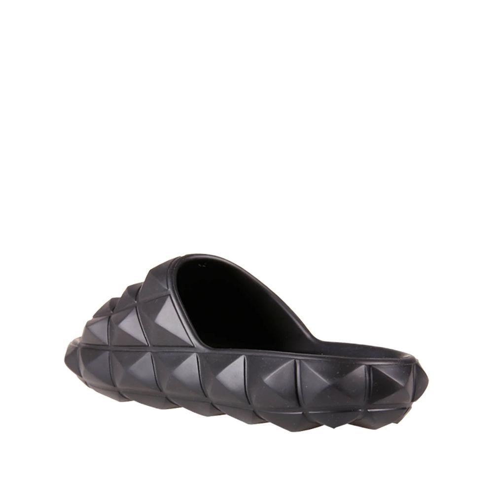 Valentino Garavani Black Rubber Slippers with all-over rubber studs, round open toe design, made in Italy, men’s footwear.