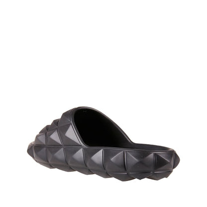 Valentino Garavani Black Rubber Slippers with all-over rubber studs, round open toe design, made in Italy, men’s footwear.