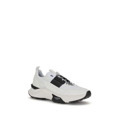 Valentino Garavani White Calf Leather Bos Taurus Athletic Sneakers with mesh, rubber detailing, and stud-embellished sole.