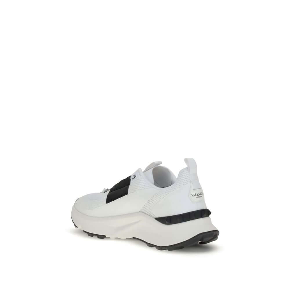 Valentino Garavani White Calf Leather Bos Taurus Athletic Sneakers with studded rubber sole, rear view.