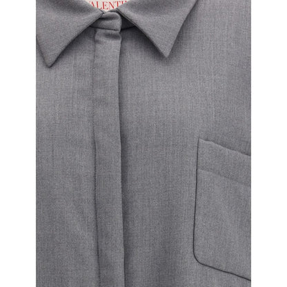 Close-up of Valentino Gray Fleece Wool Clothing featuring a pointed collar and front patch pocket with sophisticated design.