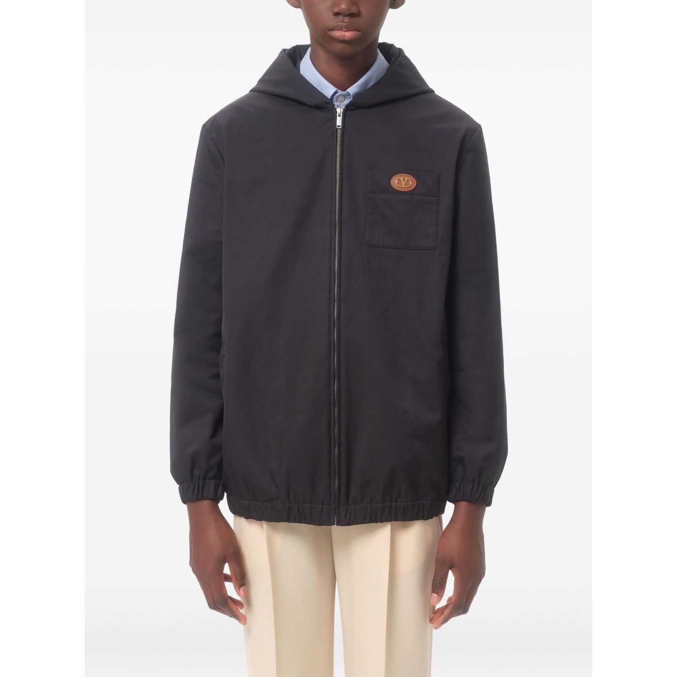 Valentino Nylon Hooded Jacket with VLogo Patch in navy blue with front zip, chest patch pocket, and two side welt pockets.