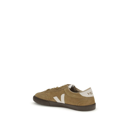 Veja Brown Leather Sneakers with iconic 'V' logo and flat sole, inspired by 1970s Brazilian volleyball shoes, side view.