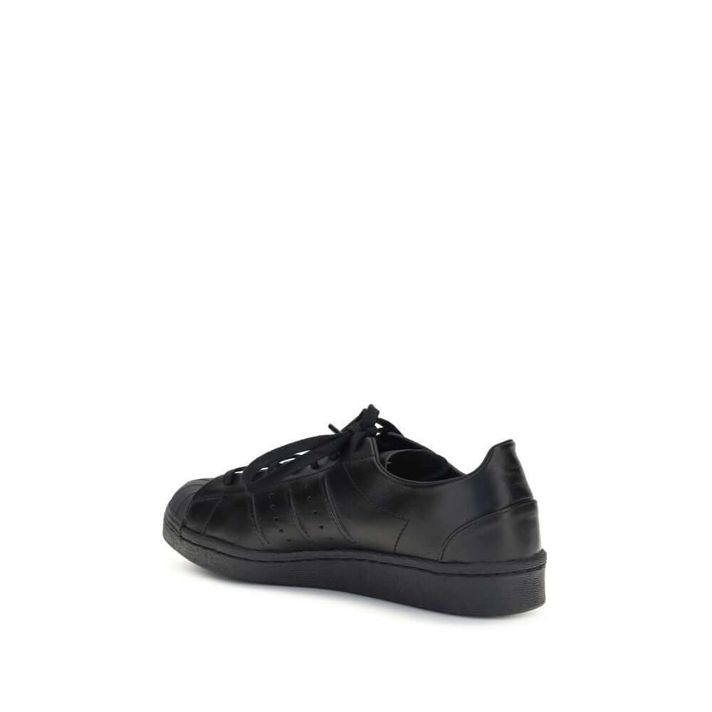Y-3 Black Calf Leather Bos Taurus Sneakers showcasing elegant design from a rear side angle.
