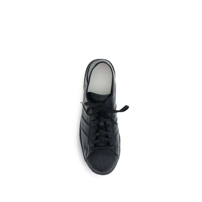 Y-3 Black Calf Leather Bos Taurus Sneakers with elegant design and classic adidas rubber shell toe from top view.
