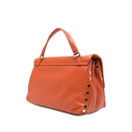 Zanellato Postina Daily Small leather handbag in orange with twist-lock, top handle, detachable strap, and stud detailing, side view.