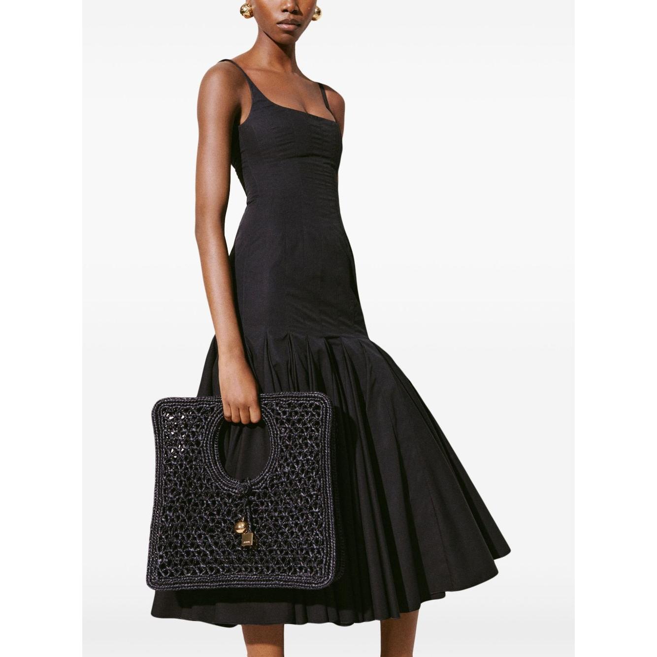 Front view with bag zipped and handles upright.